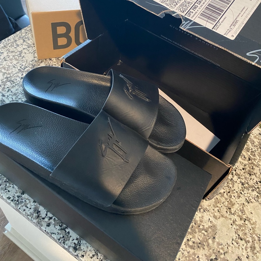 Black brand new slides . Size 13 Giuseppe